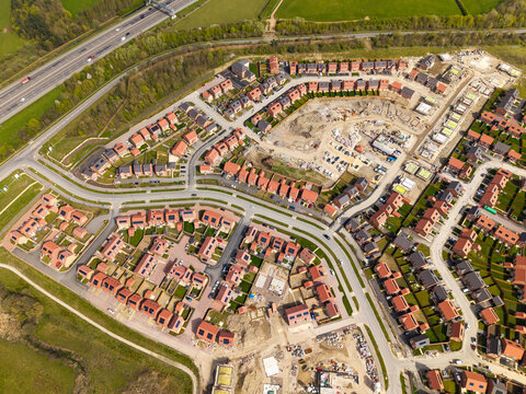 Aerial view directly above affordable new build housing construction site in the UK
