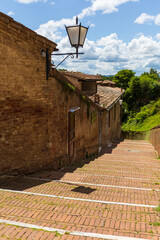 Fototapeta premium Historic Brick Street in Siena, Italy