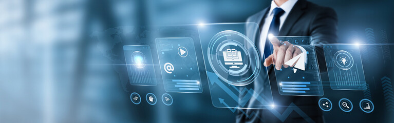 Businessman pointing at digital screen with e-learning data and analytics interface. online education, virtual training, digital courses, learning platform, educational technology, remote learning