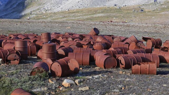 Former Bluie East Two, Ikkatteq US Air Force airfield in East Greeland with empty oil drums and machinery