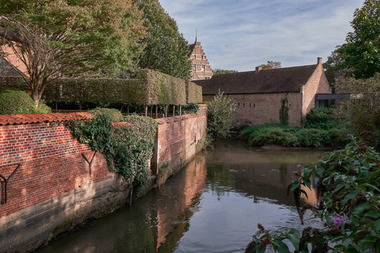 Scenic river view with historic brick buildings in the Great Beguinage - Leuven, Belgium