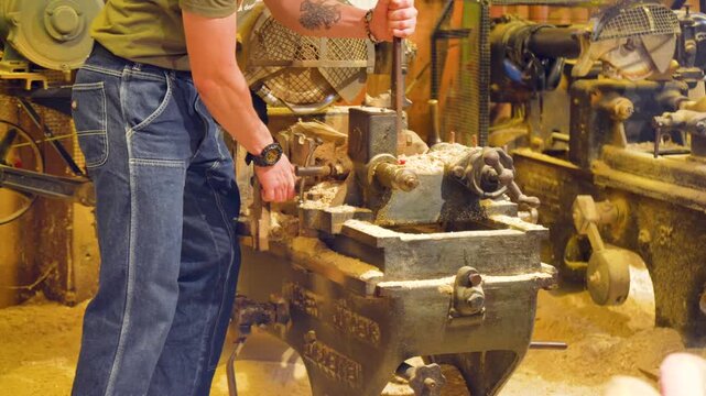 Clogs making. A clog maker also called wooden shoes in holland is engraving original dutch clogs, this craft can be seen at the cheese market