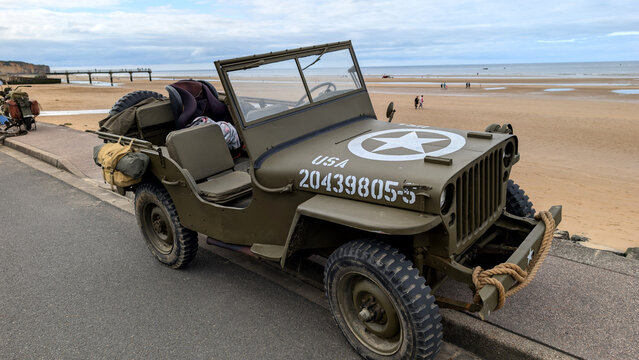 Omaha Beach, Normandy, France -05.29.2025: Willys MB military jeep on Omaha Beach, Normandy, France. 