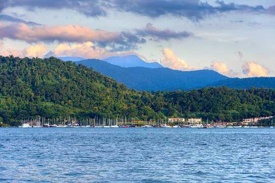 Sunset seascape with the yacht club in the background in Paraty, Rio de Janeiro, Brazil. Paraty is a preserved Portuguese colonial and Brazilian Imperial municipality.