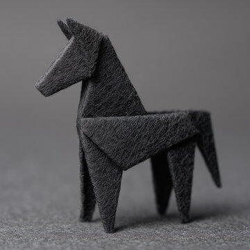A sleek, stylized figure of a horse crafted from dark-toned material, showcasing angular features and a minimalist design.