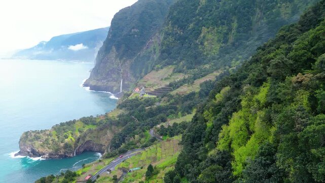 Seixal, Madeira: A stunning aerial view of the coastal village, its iconic natural volcanic pools, and lush terraced hillsides meeting the vibrant Atlantic.