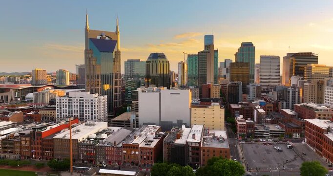 Downtown of Nashville, Tennessee with modern skyline at sunset. Vibrant urban atmosphere in American city.