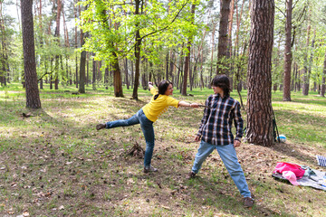 Fototapeta premium Family Having Fun in Nature During Picnic
