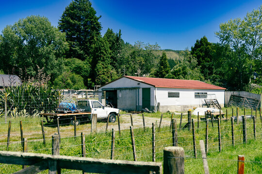 Rural Farm Shed Beside Old Utility Truck