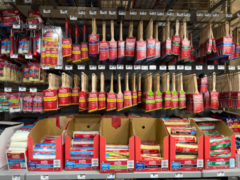 Prosper, Texas, USA - April 1st, 2026: Various Wooster Pro synthetic paint brushes and roller covers hanging on retail shelves in The Home Depot