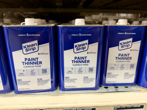 Prosper, Texas, USA - April 1st, 2026: Rows of Klean Strip Paint Thinner blue metal cans with white plastic caps displayed on store rack in The Home Depot