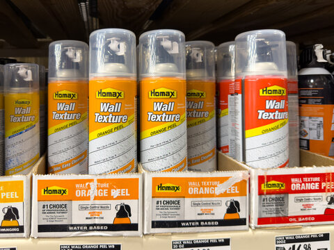 Prosper, Texas, USA - April 1st, 2026: Cans of Homax Wall Texture Orange Peel water based spray with single control nozzles in cardboard boxes in The Home Depot