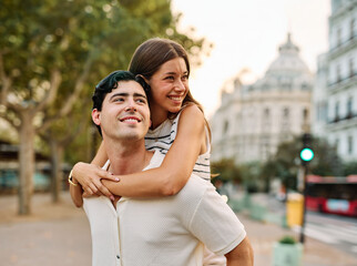 Obraz premium Couple enjoys a sunny day walking together in a charming urban area during late afternoon or tourists visiting a destination