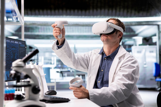 Researcher using VR headset in lab to explore 3D interactive simulations of biochemistry and nanotechnology. Tech gadget demonstrates innovation in science and advanced research for medicine.