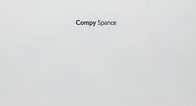 Plain grey background with small black text that reads "Compy Space", minimalist, simple, clean