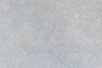 Light gray stone or concrete texture background with subtle grain and natural pattern. Neutral minimal surface for design and architecture use