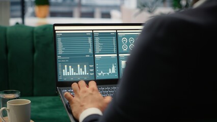 Visionary entrepreneur sits in a high end corporate workspace, focusing on investment planning and...