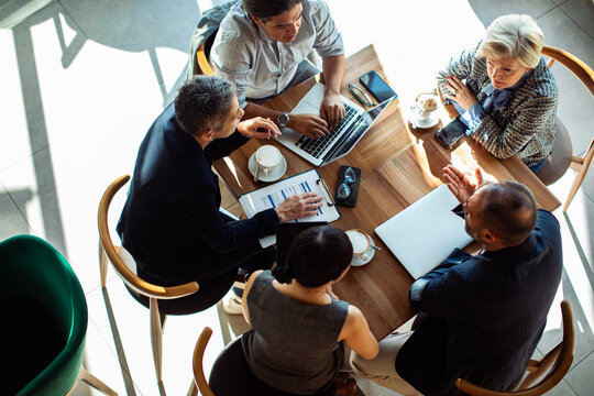 Top view of business team meeting in cafe