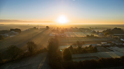 Hot summer day with views of farmland ploughed fields rural scene with open landscape aerial vista of a rural English village in Lincolnshire. Sunset sunrise © MD Media