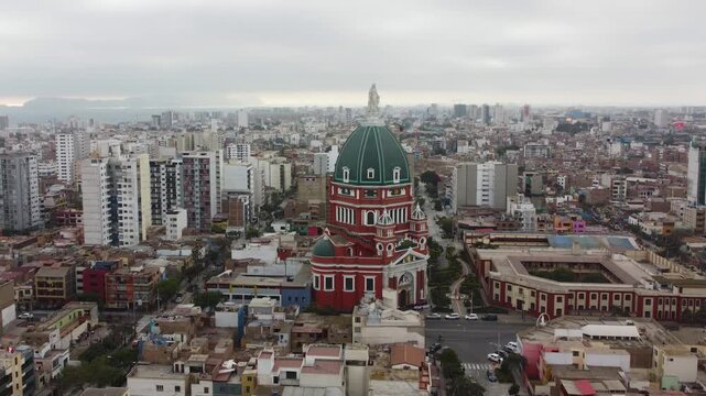 Aerial drone pan shot of Iglesia del Inmaculado Coraz&oacute;n de Mar&iacute;a full view, Magdalena del Mar, Lima, Peru