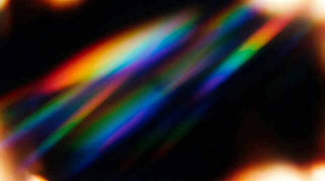 Abstract rainbow neon light streaks with colorful glow and bokeh, motion blur background