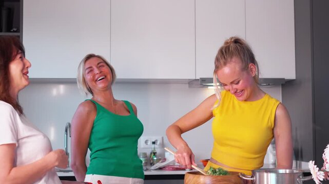 Two friends share laughter and fun as they bake together in a bright kitchen filled with delight. Their smiles light up the room bringing warmth and joy.