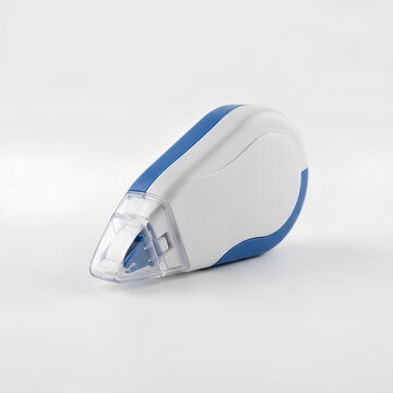 Closeup of a white and blue correction tape dispenser on a white background.