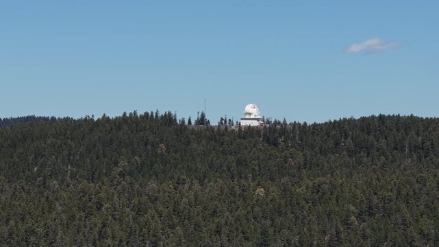 Aerial of observatory in Cloudcroft New Mexico on sunny day on Alamo Peak