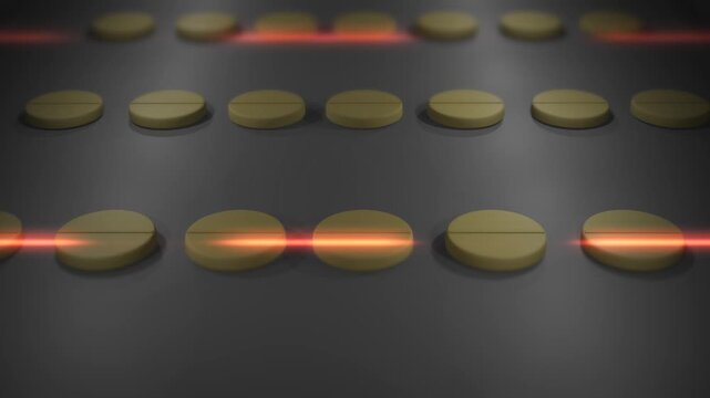 Circular Chewable Pills Flowing Down a Conveyor Belt