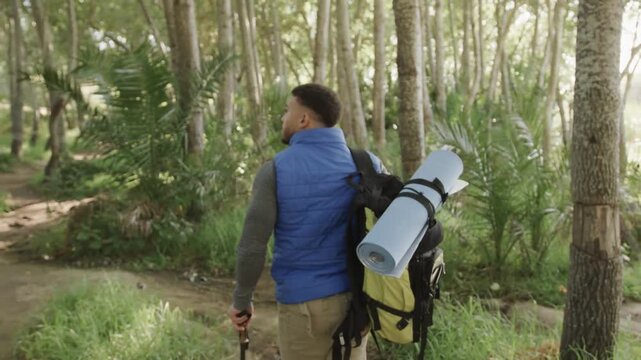 Male hiker walking path, VIBES appearing, fading, returning, highlighting backpack for travel