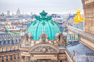 Obraz premium Oxidized green dome and golden statues shine over Paris. This iconic opera house stands grand against a backdrop of historic architecture
