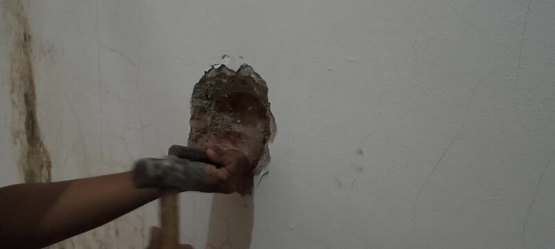 break the wall with a chisel and hammer