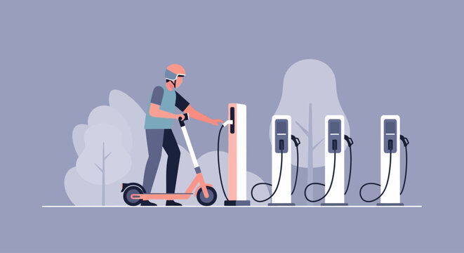 Electric scooter rider charging at station