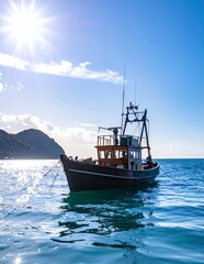Obraz premium Fishing Boat on Calm Blue Water Under Bright Sun and Clear Sky.