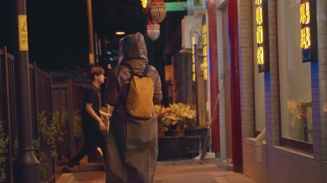Asian woman night neonlit alleyway exploring, backpacker pausing under lanterns, tourist scanning storefront windows, student adjusting hood, solitary explorer gazing upward, moody cinematic lighting,