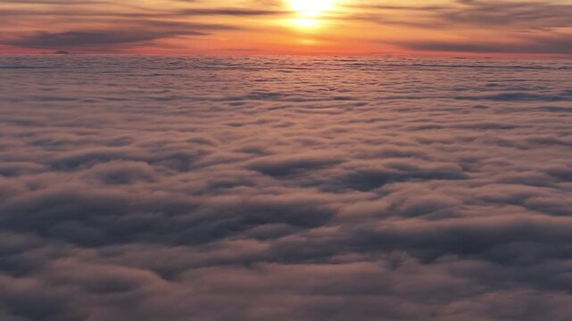 Drone sunset above the clouds