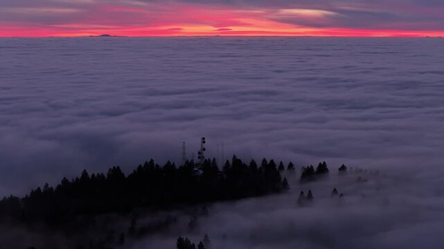 mountains peaking through an inversion during sunset