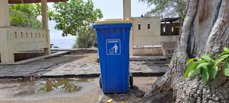 Trash Bin on Beachside Near the Sea with Coastal Background