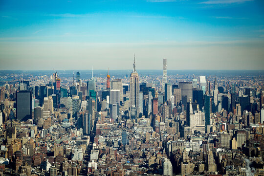 NEW YORK, NY - February, 13th, 2018: High angle view of the Manhattan skyline featuring the Empire State Building at sunset