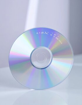 Close-up of a blank CD-R disc reflecting light, ready for data storage.