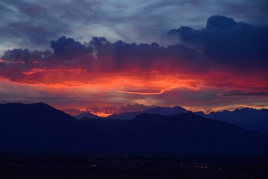 colorful sunset over  colorado's front range  of the rocky  mountains  in spring,  looking towards boulder, as seen from broomfield, colorado