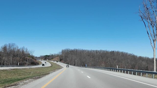 Cars Drive on Freeway in Appalachian Mountains of Ohio