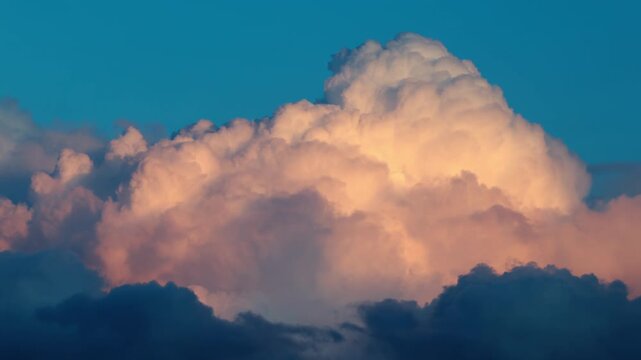 Timelapse of dark storm clouds moving rapidly Running across the sky at sunset, dramatic atmospheric buildup with dense thundercloud formations signaling approaching severe weather and hurricane