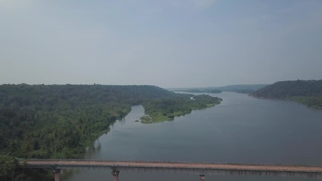 Aerial view showcasing the Kalawali Bridge crossing Karli River's backwaters in Devbag, Malvan region of Maharashtra's Konkan coast.
