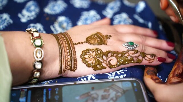 A close-up shot of the hands of a Pakistani bride with mehendi 