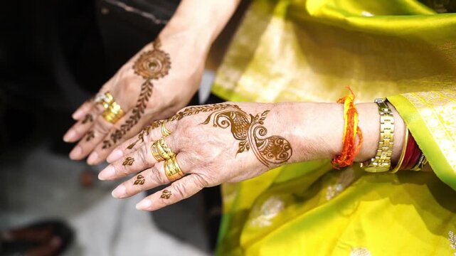 Beautiful bridal mehendi art on a woman's hand, a traditional cultural ritual for weddings in South Asia.