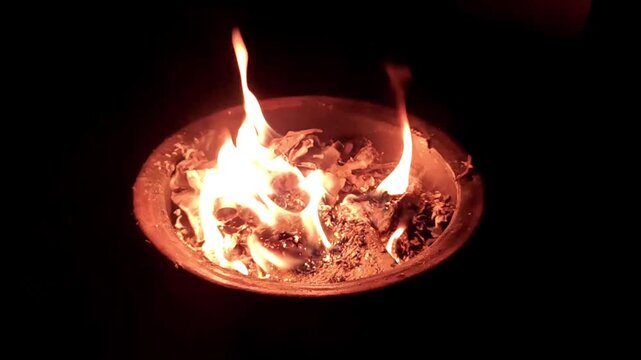Burning white paper in a fireplace