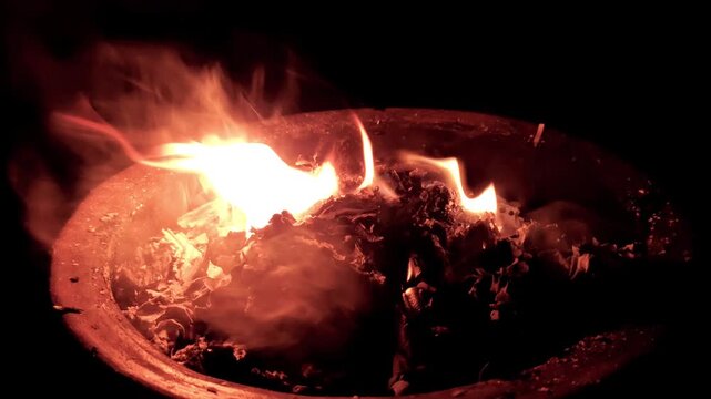 Paper documents burning in a fireplace