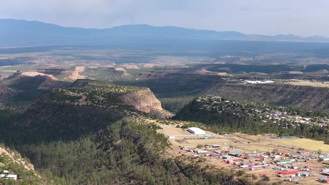 This Los Alamos destination shot highlights the mesa top, deep canyon, and expansive forest. The cinematic view is ideal for tourism marketing, adventure travel, and nature content.