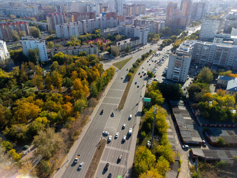 High-angle drone shot (top-down / bird's-eye view) of Profsoyuznaya Street in Tyumen, Russia, captured on September 20, 2022, using a DJI Mini 2. The image shows the central city street with the